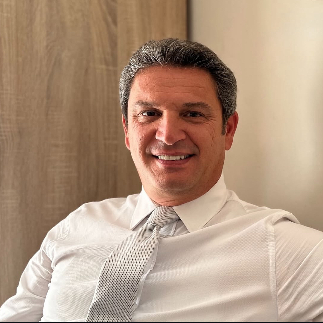 Portrait of Ryan Combs, Director of Tax Strategy, professional headshot in business attire